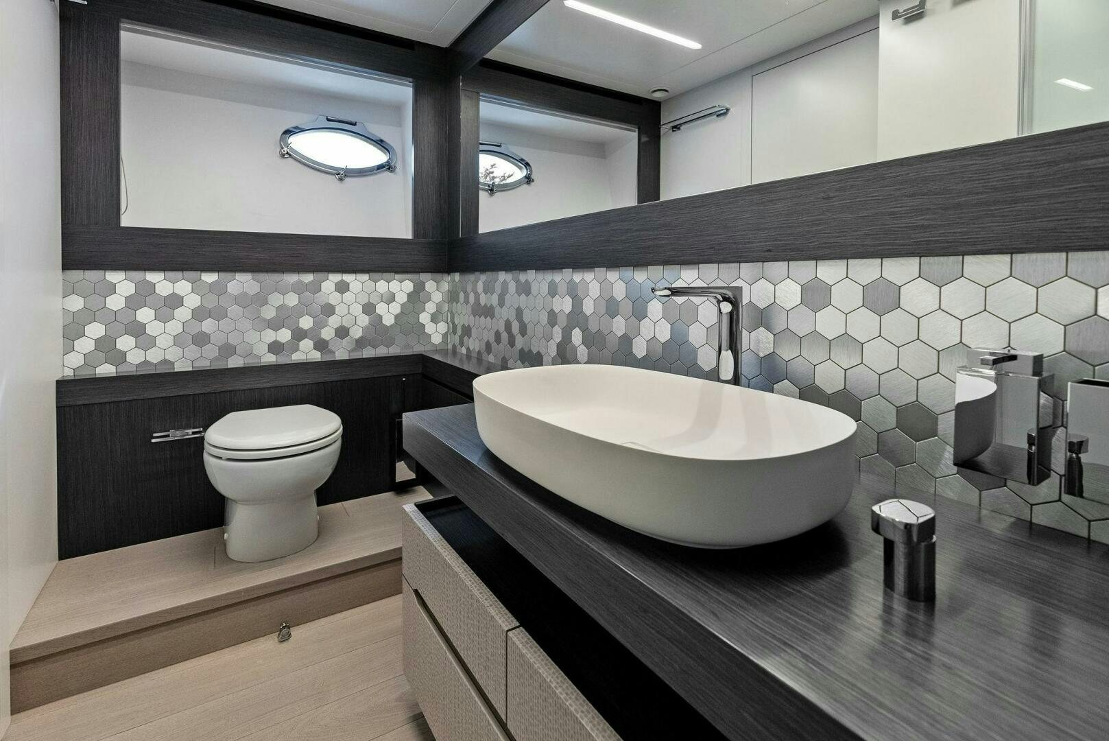 a bathroom with a sink and toilet aboard OUR TRADE Yacht for Sale
