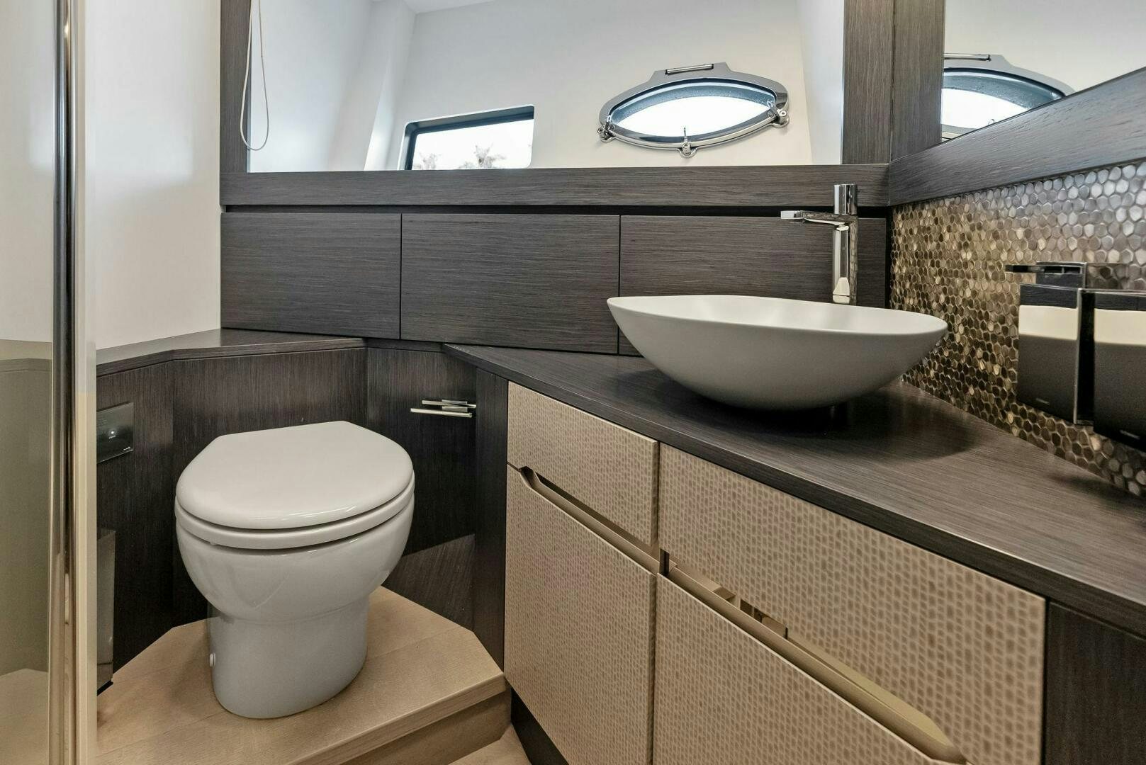 a bathroom with a sink and a toilet aboard OUR TRADE Yacht for Sale