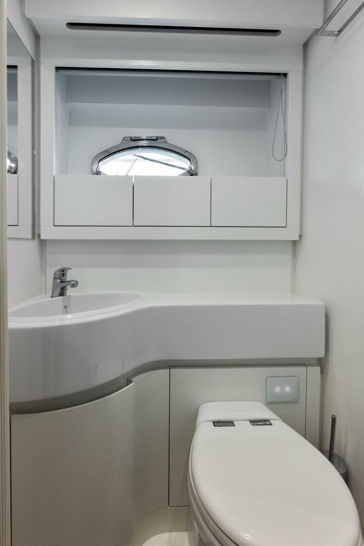 a bathroom with a toilet and sink aboard OUR TRADE Yacht for Sale