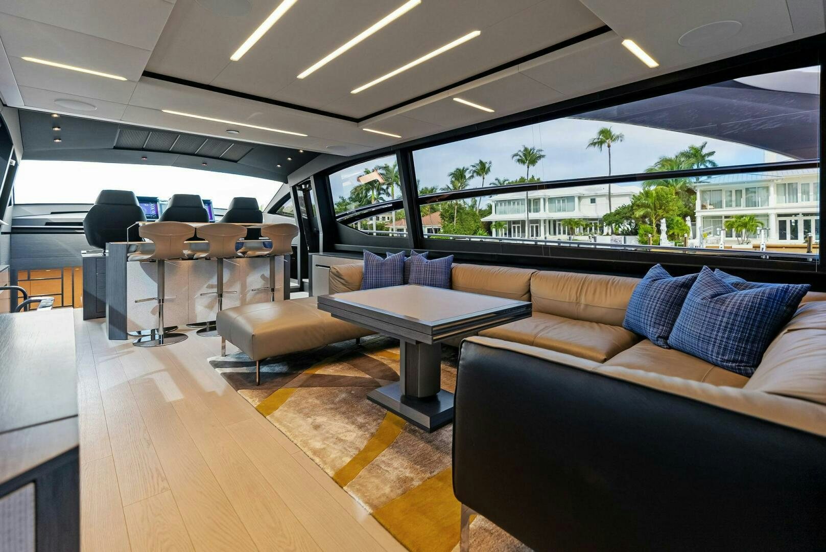 a room with couches and a table and chairs aboard OUR TRADE Yacht for Sale