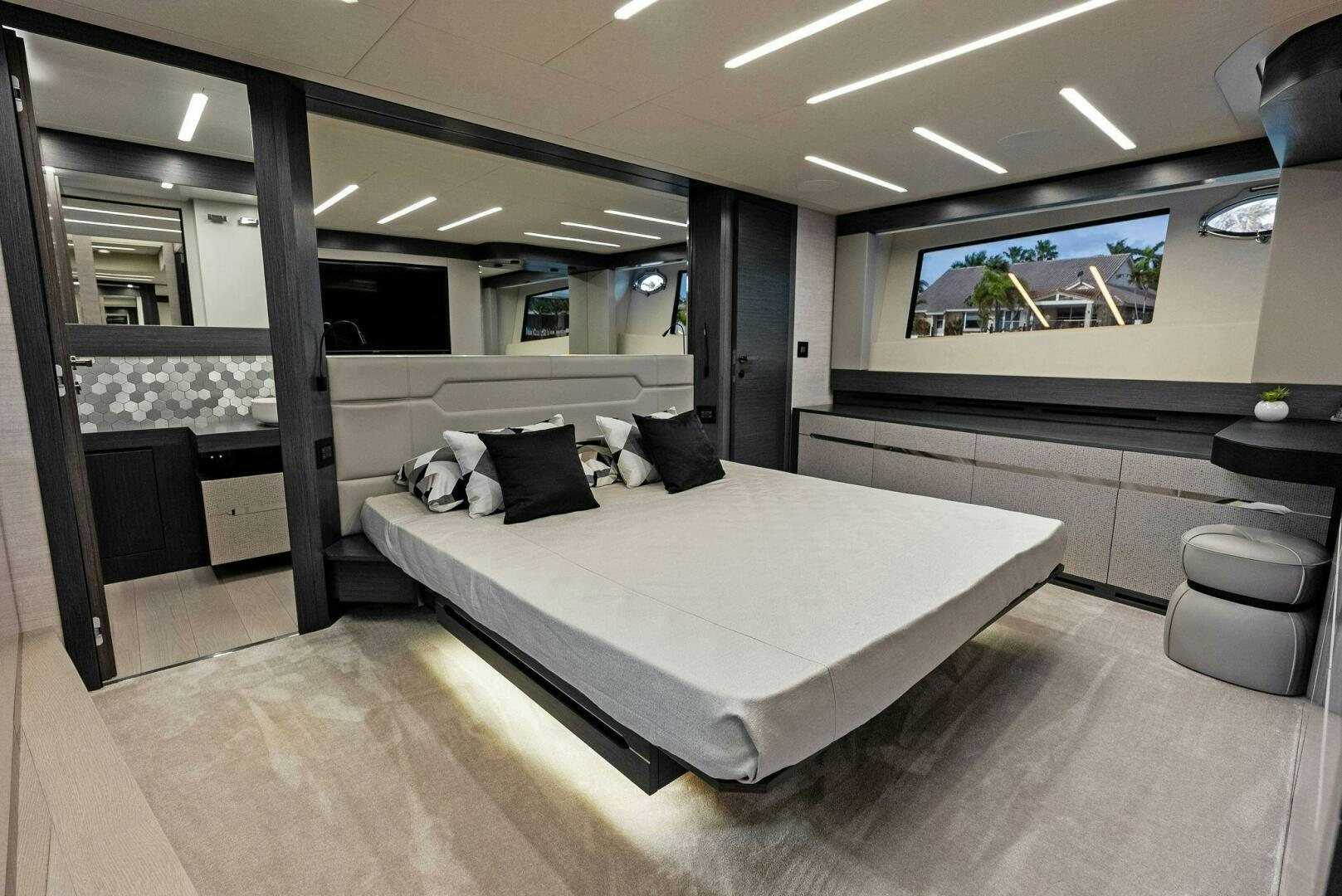 a room with a bed and a mirror aboard OUR TRADE Yacht for Sale