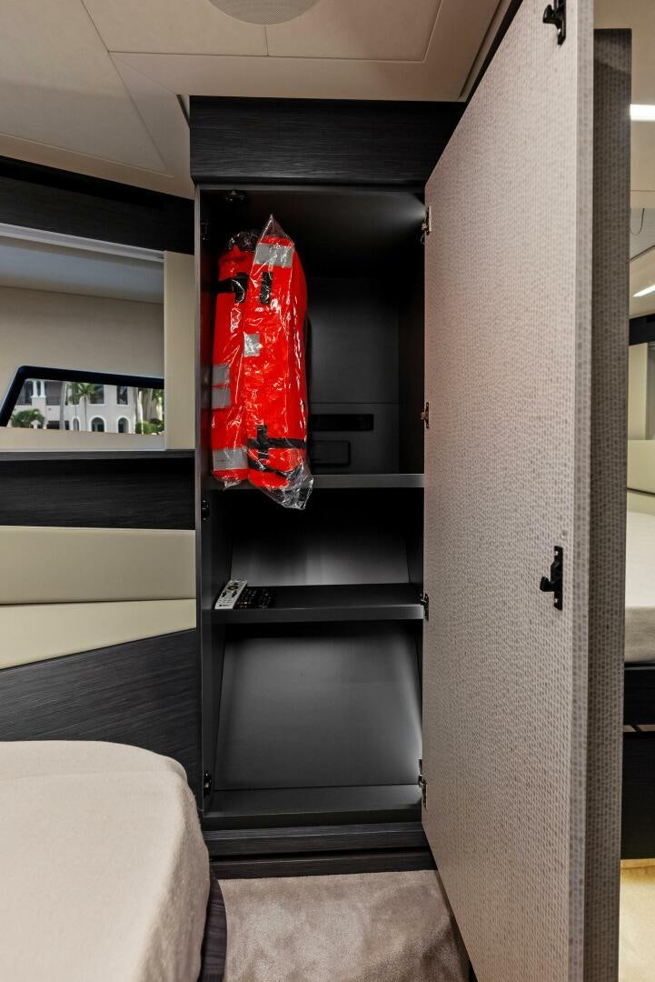 a black door with red curtains aboard OUR TRADE Yacht for Sale