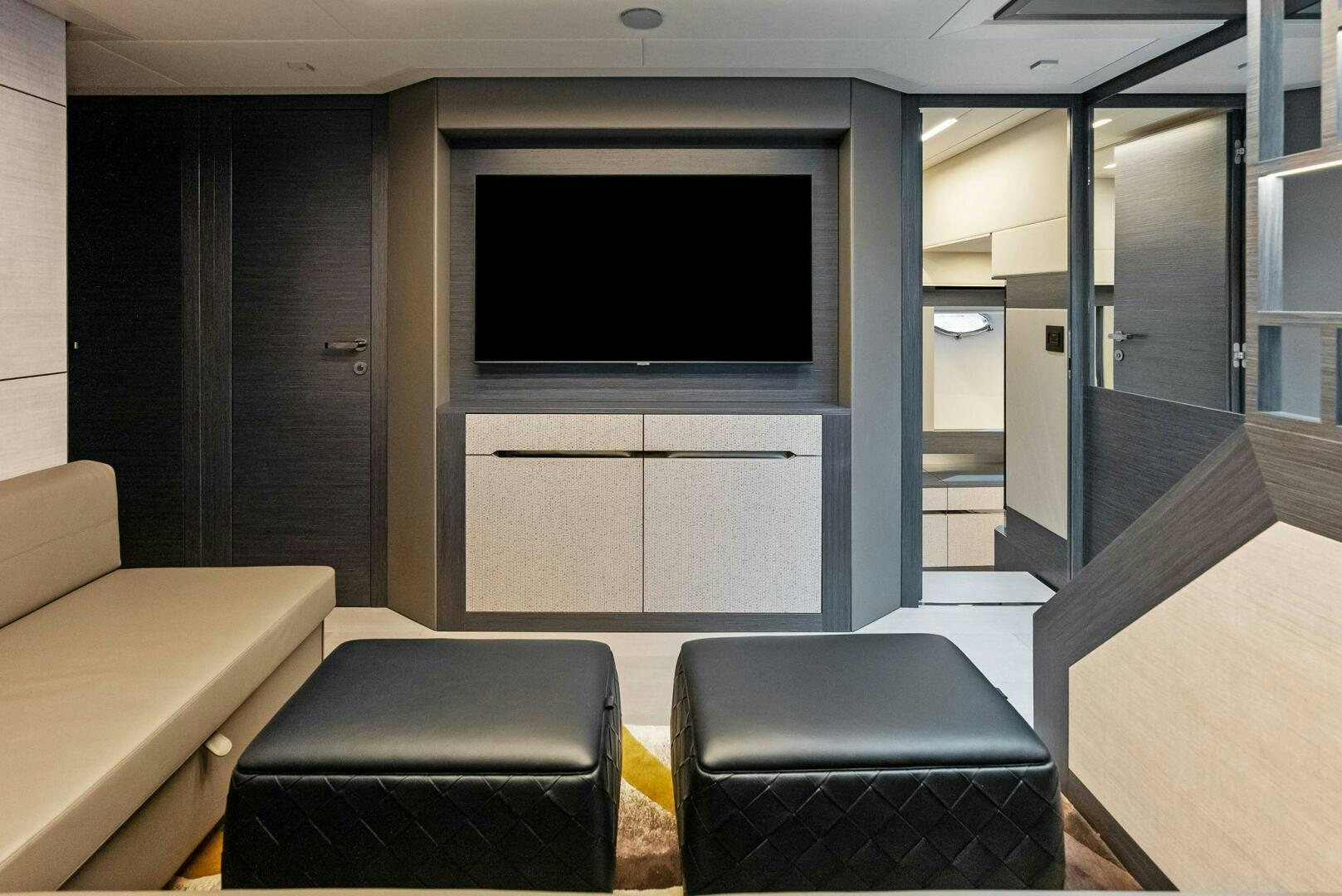 a room with a couch and a tv aboard OUR TRADE Yacht for Sale