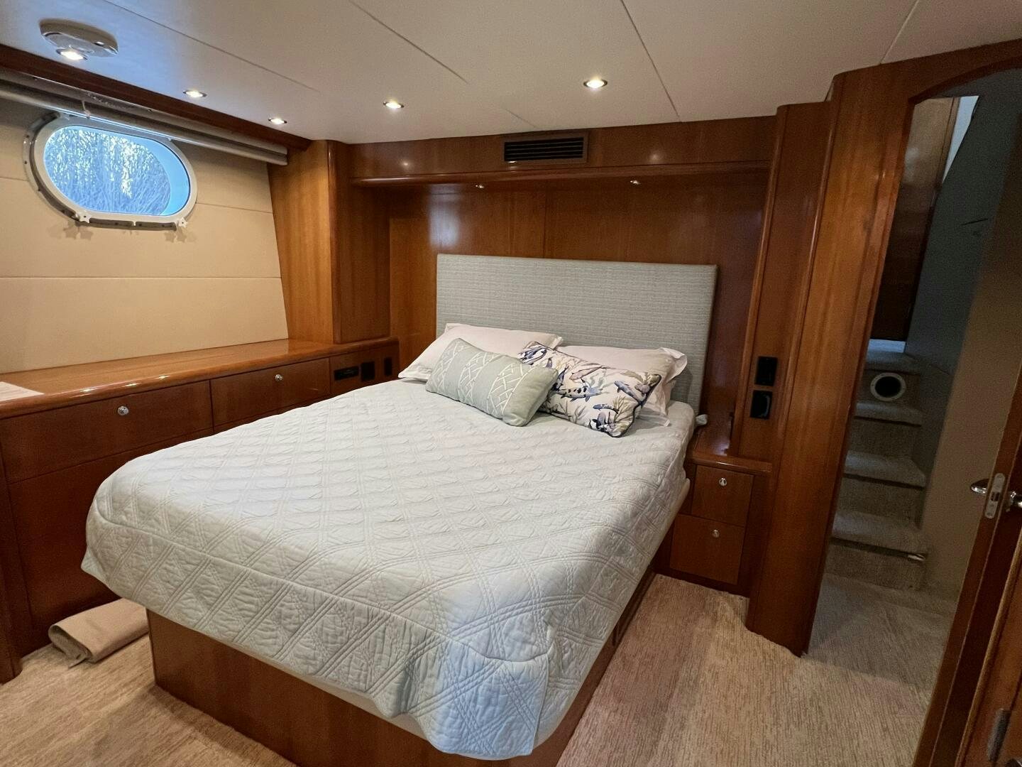 a room with a bed and a mirror aboard BAYOU A BUD Yacht for Sale