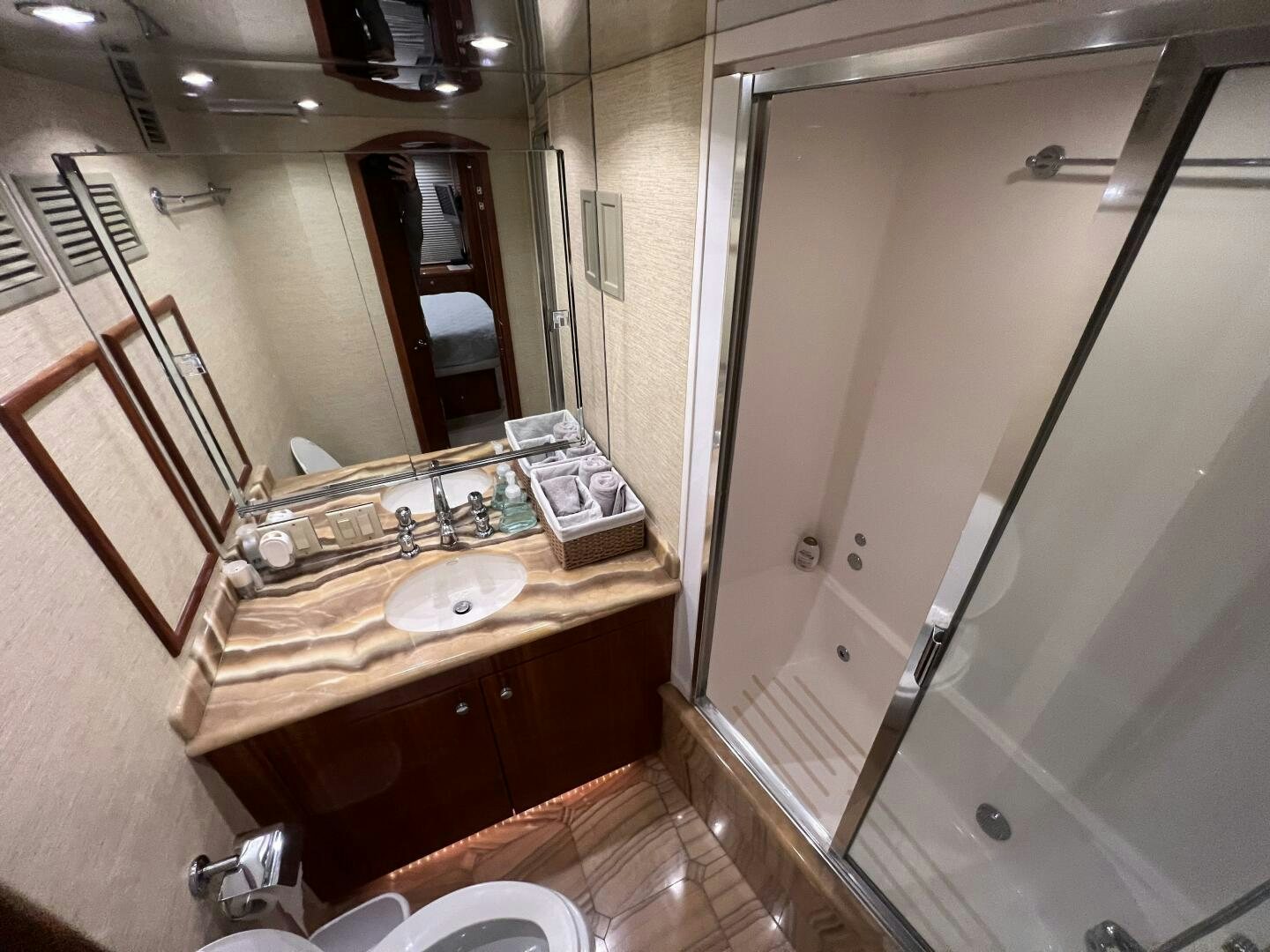 a bathroom with a sink and a mirror aboard BAYOU A BUD Yacht for Sale