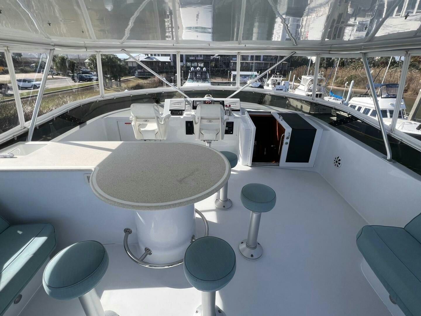 a large white table with chairs around it aboard BAYOU A BUD Yacht for Sale