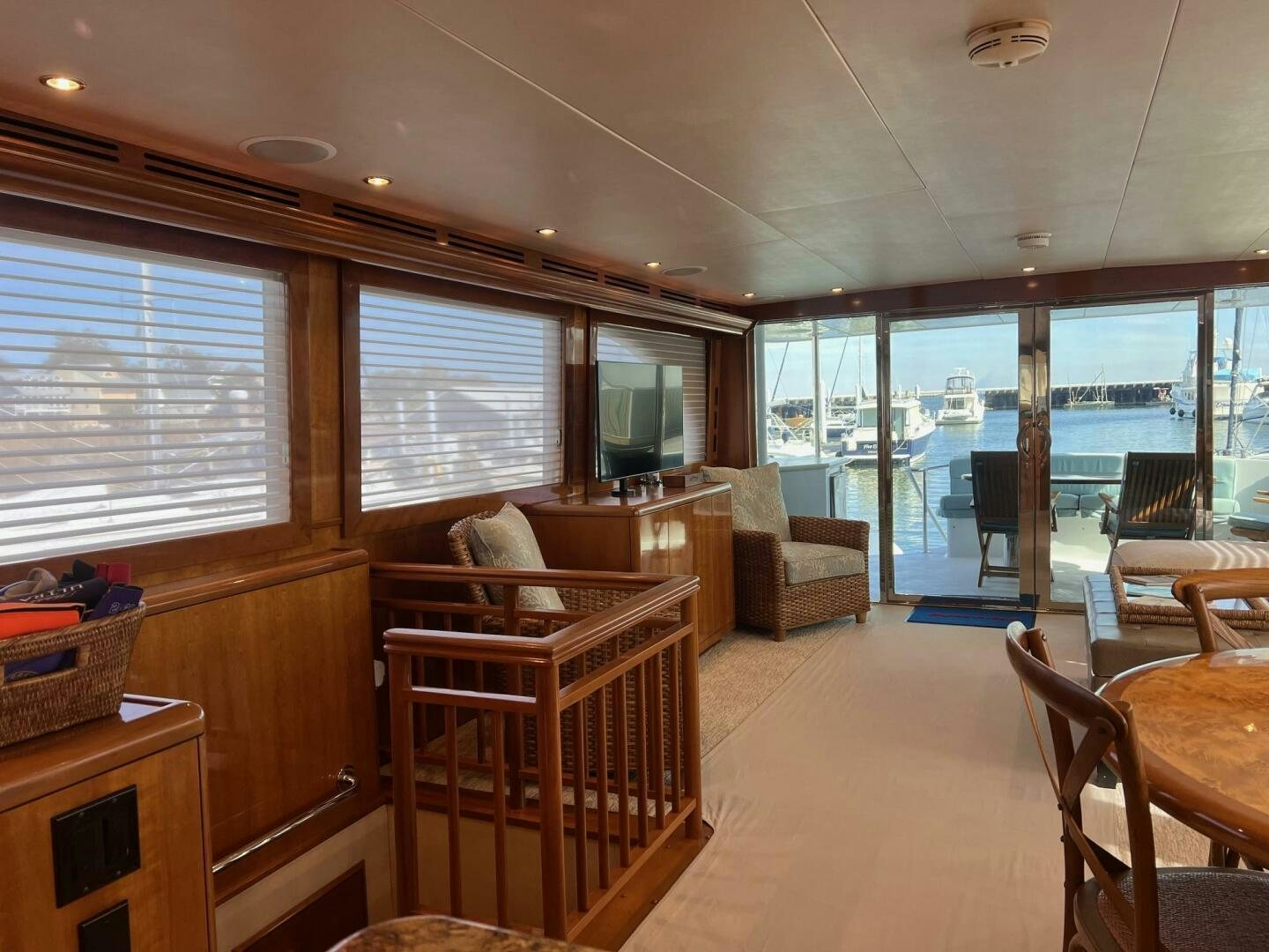 a living room with a view of the water aboard BAYOU A BUD Yacht for Sale
