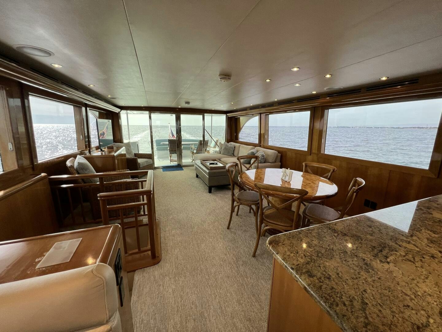 a large room with tables and chairs aboard BAYOU A BUD Yacht for Sale