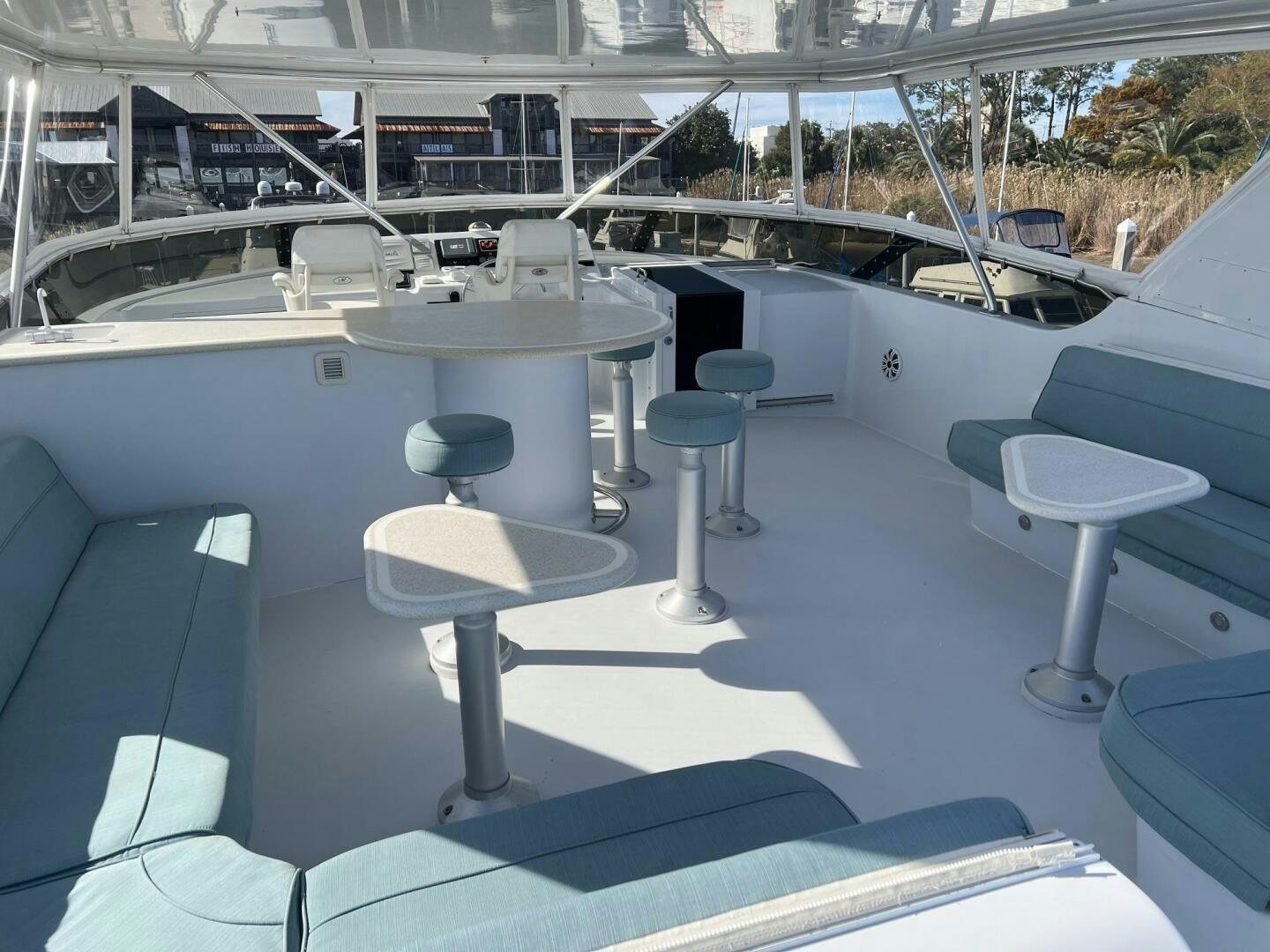 a pool with tables and chairs aboard BAYOU A BUD Yacht for Sale