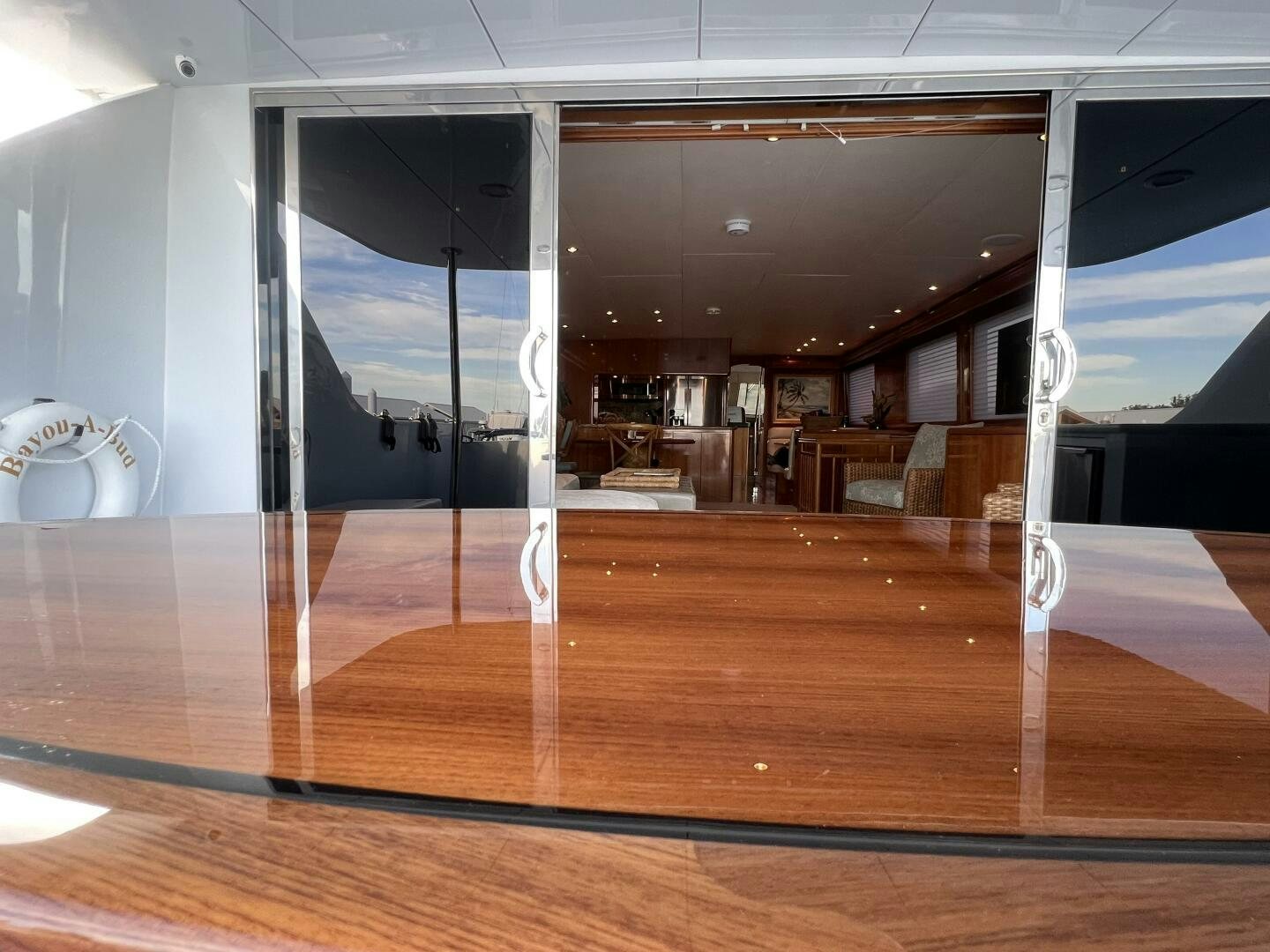 a room with a wood floor and a large mirror aboard BAYOU A BUD Yacht for Sale