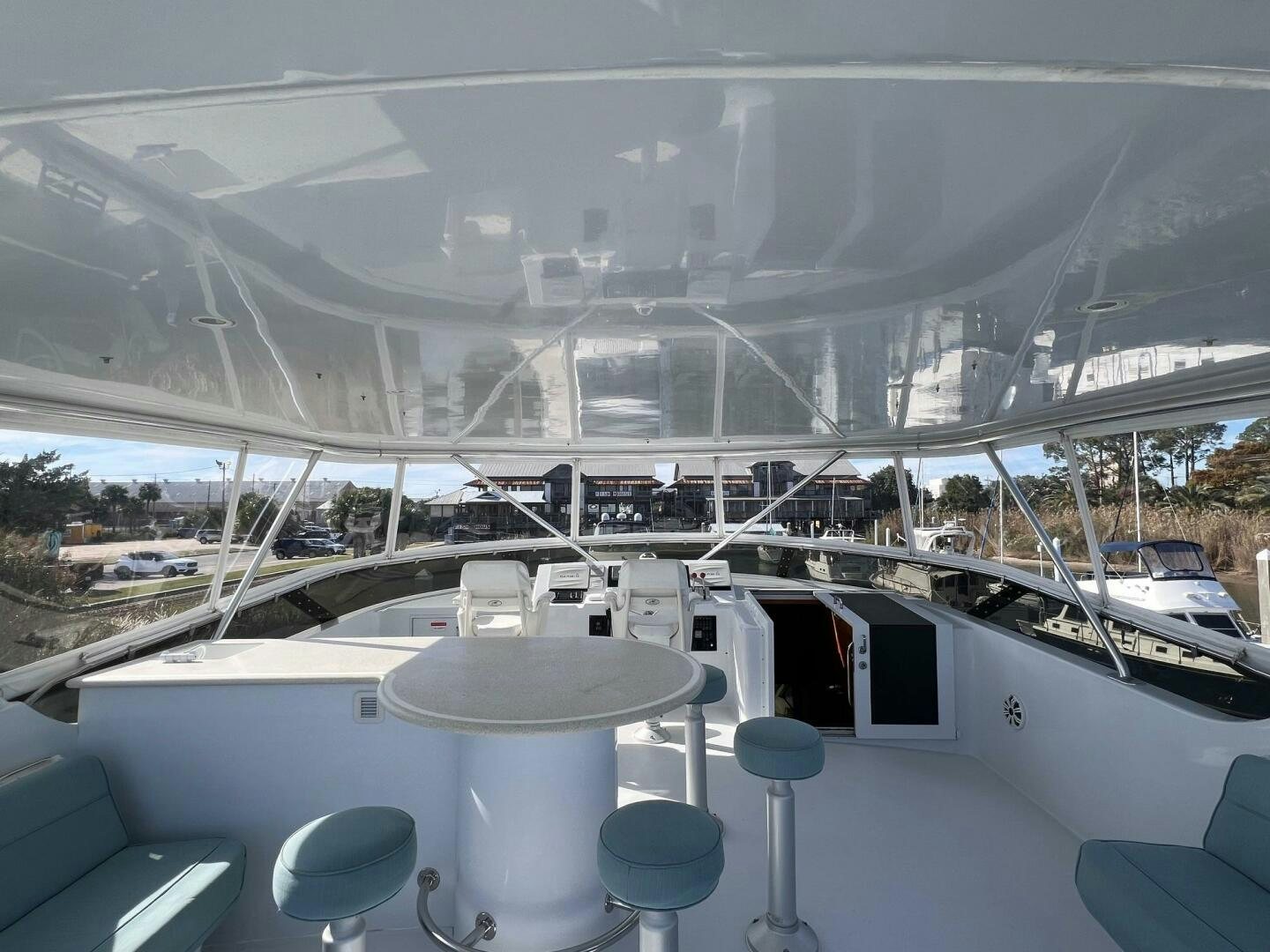 a large white building with a balcony aboard BAYOU A BUD Yacht for Sale
