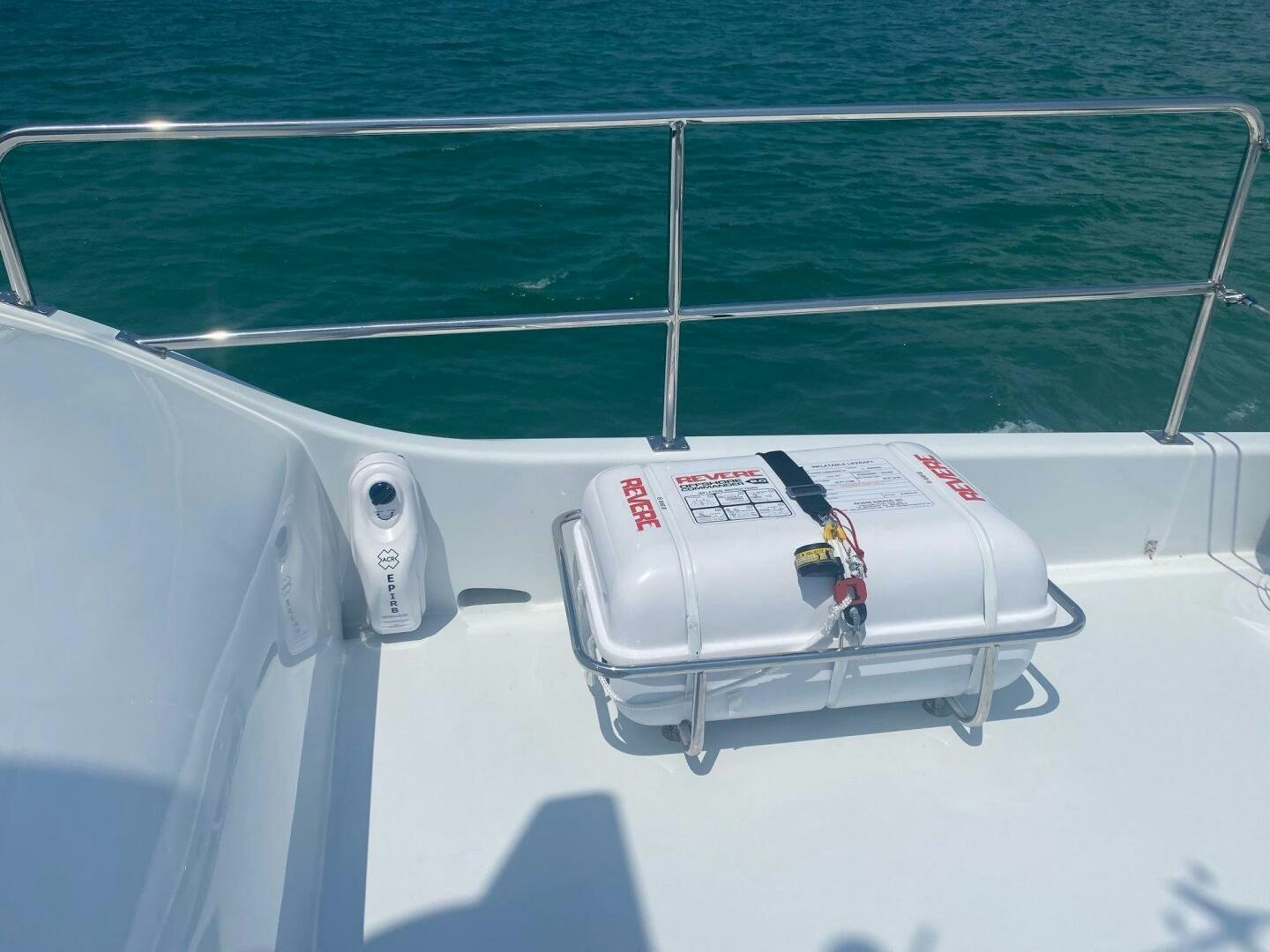 a white boat on a body of water aboard BAYOU A BUD Yacht for Sale
