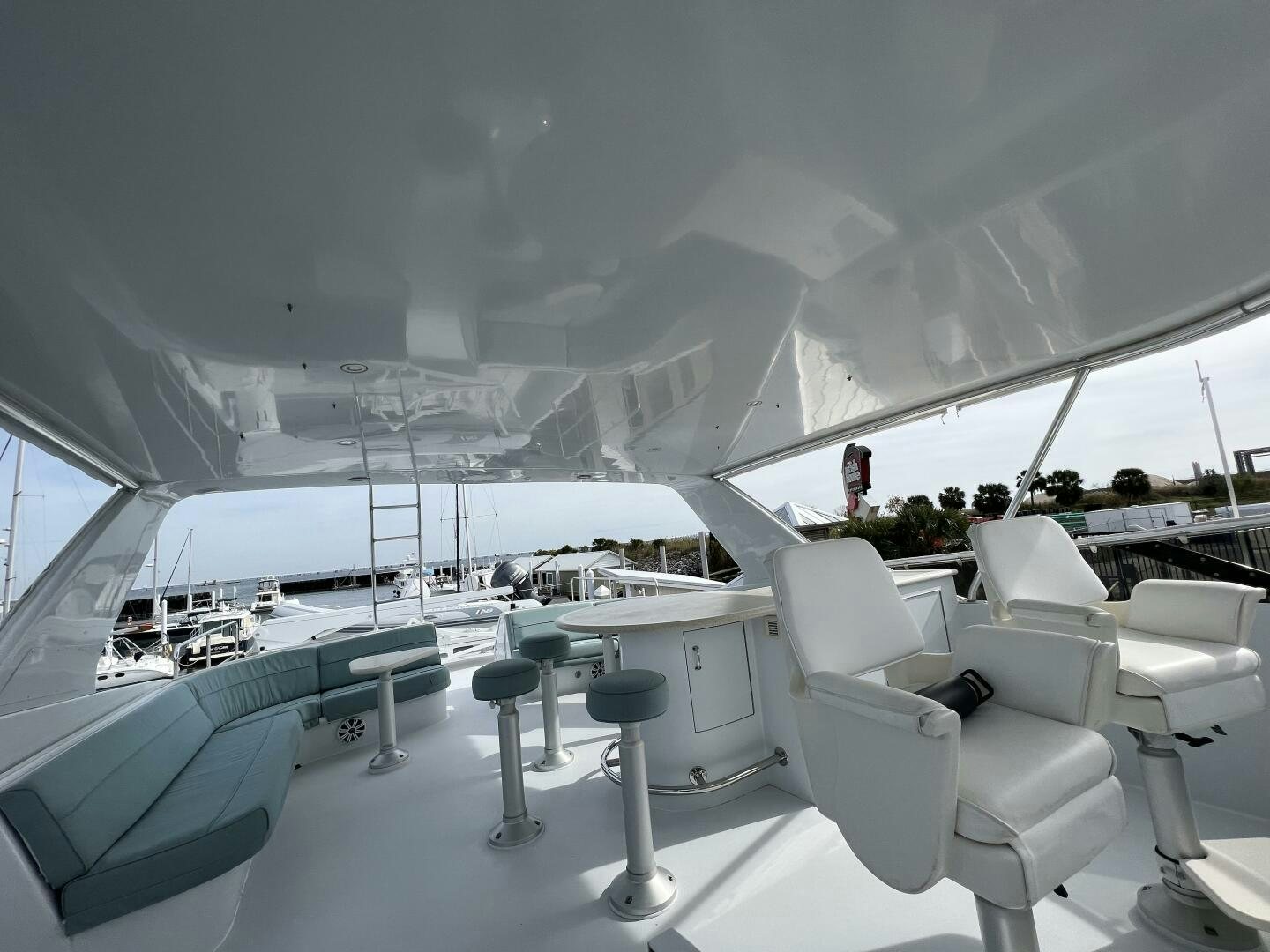 a room with a view of the water and a boat aboard BAYOU A BUD Yacht for Sale