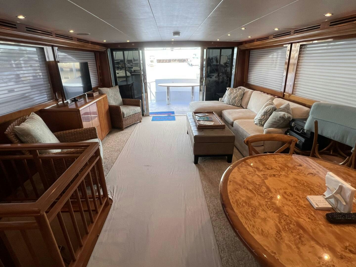a living room with a table and couches aboard BAYOU A BUD Yacht for Sale