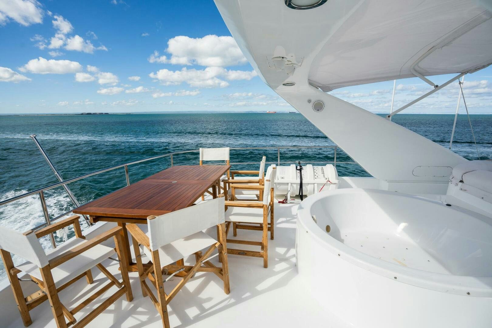 a table and chairs on a boat aboard PURA VIDA  Yacht for Sale