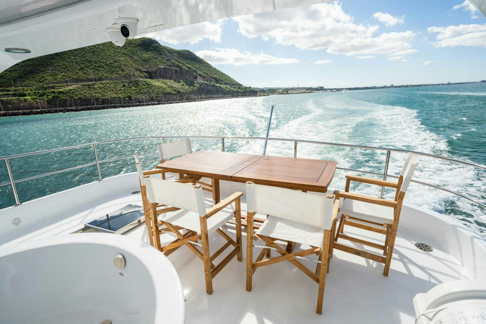 a table and chairs on a boat aboard PURA VIDA  Yacht for Sale
