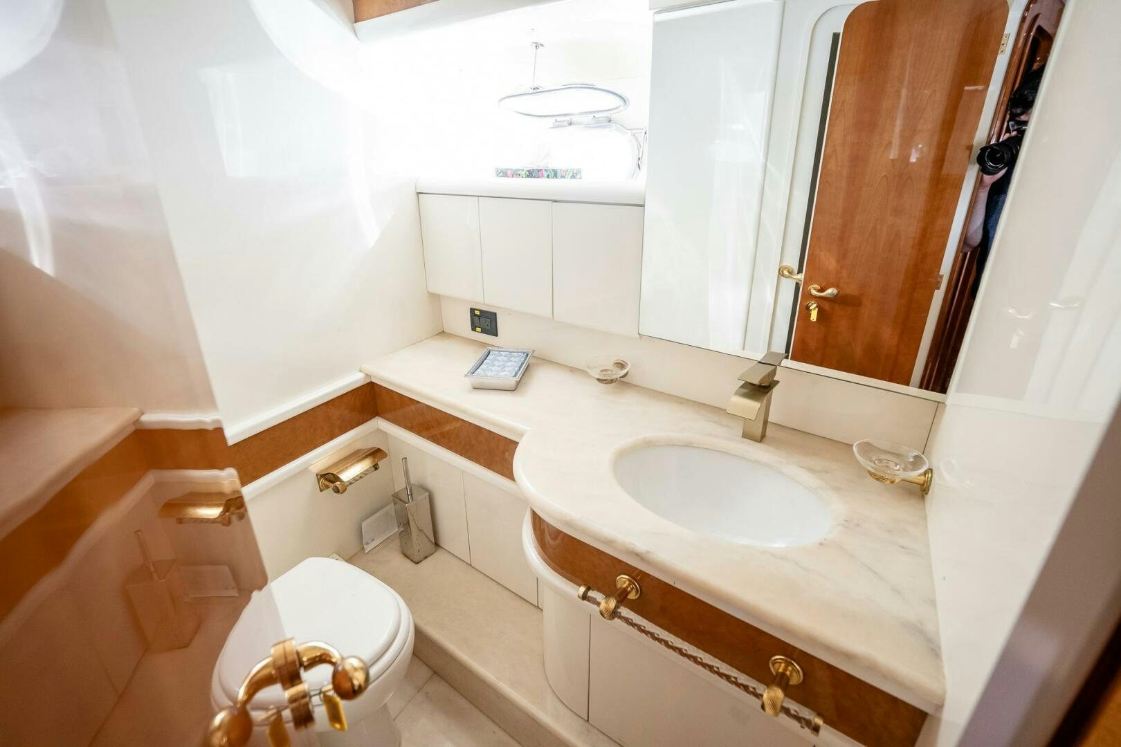 a bathroom with a sink and a toilet aboard PURA VIDA  Yacht for Sale