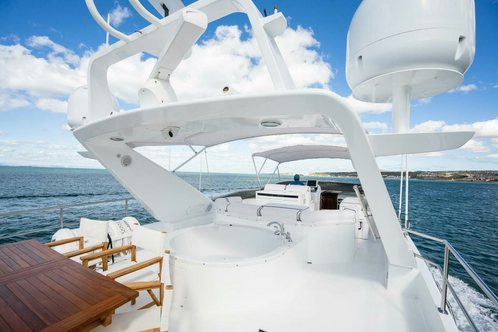 a white boat on the water aboard PURA VIDA  Yacht for Sale