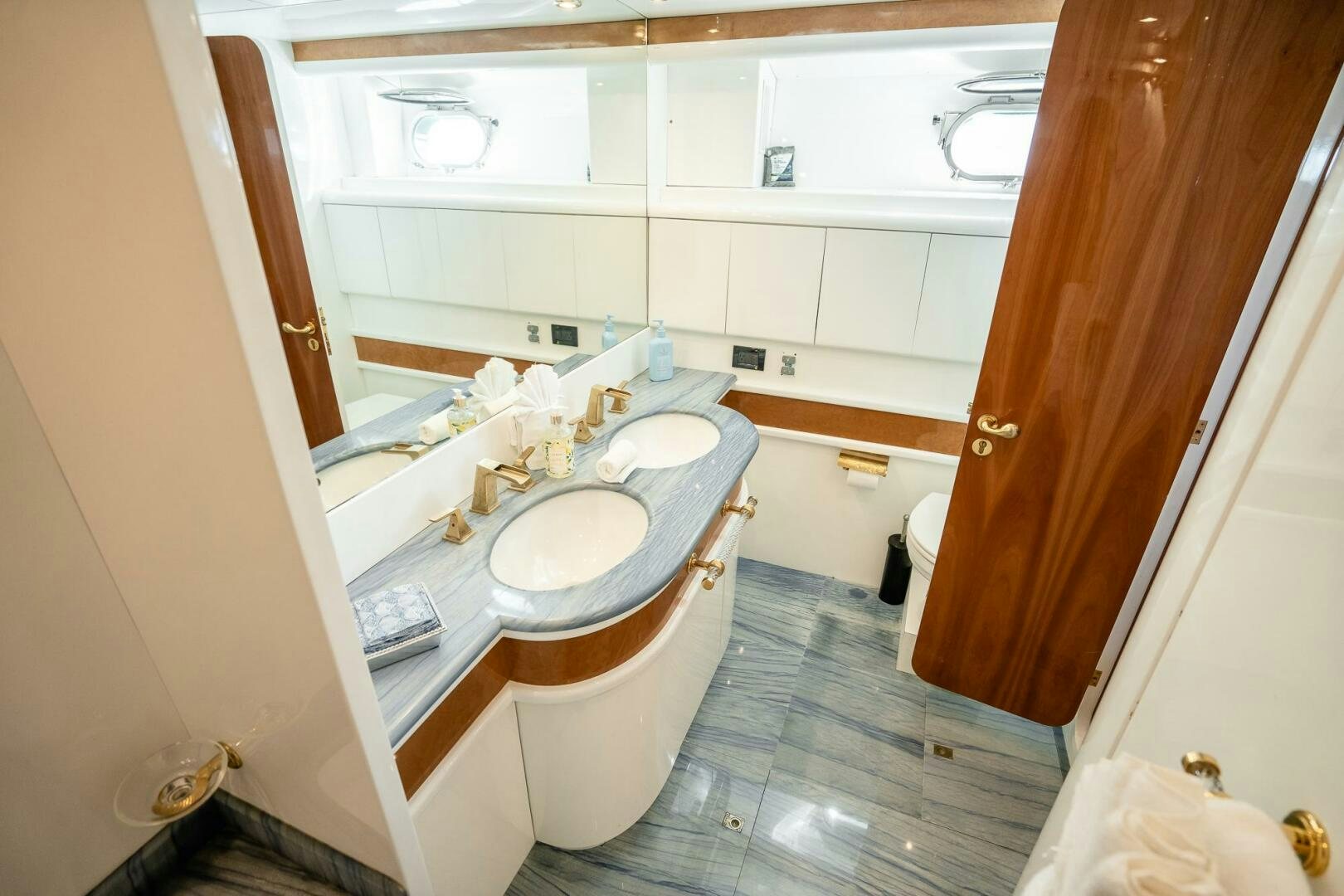 a bathroom with a sink and a toilet aboard PURA VIDA  Yacht for Sale