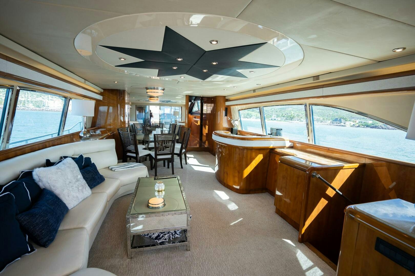 a large living room with a large window aboard PURA VIDA  Yacht for Sale