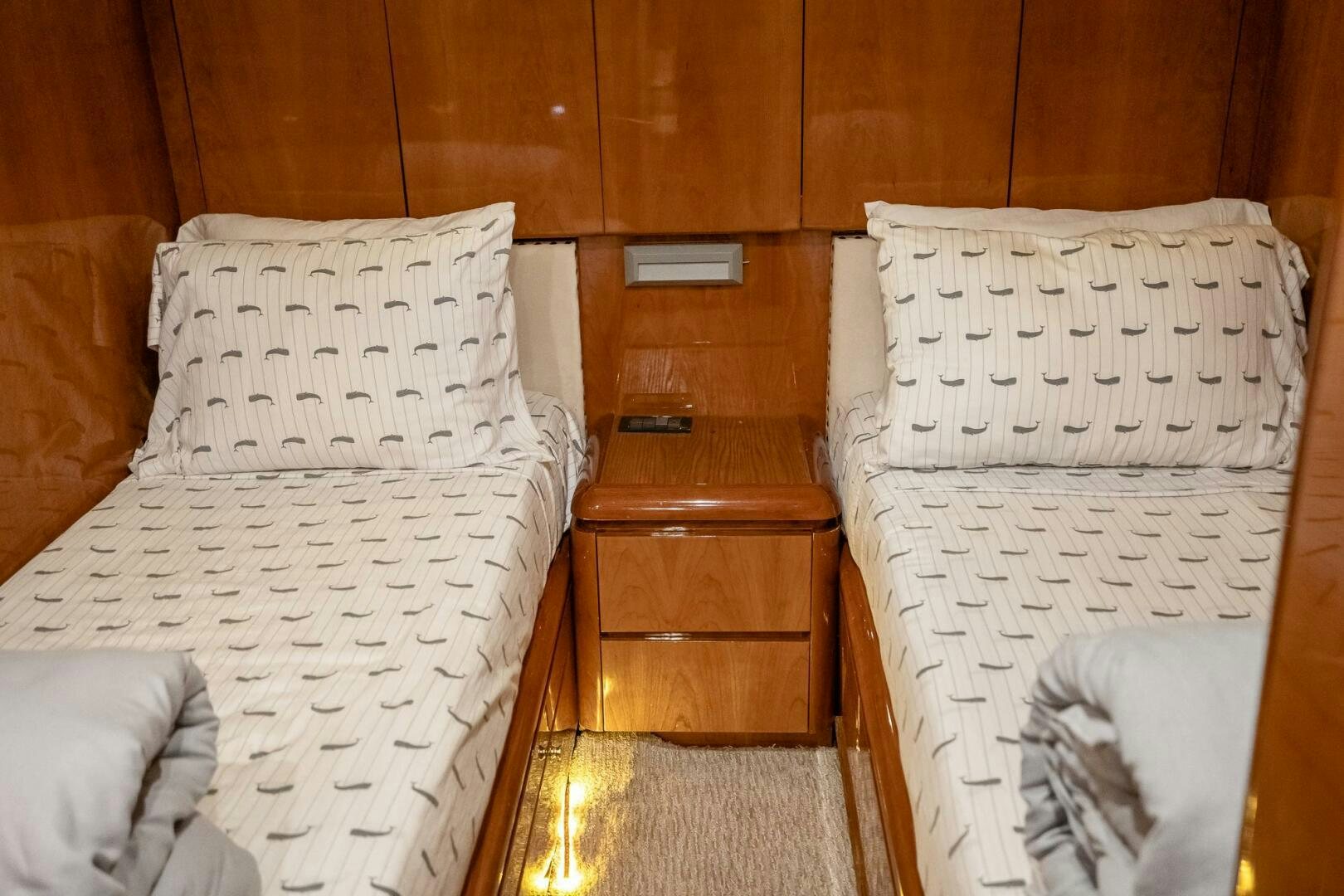 a couple of beds in a room aboard PURA VIDA  Yacht for Sale