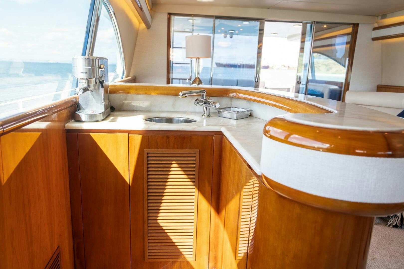 a kitchen with a sink and cabinets aboard PURA VIDA  Yacht for Sale