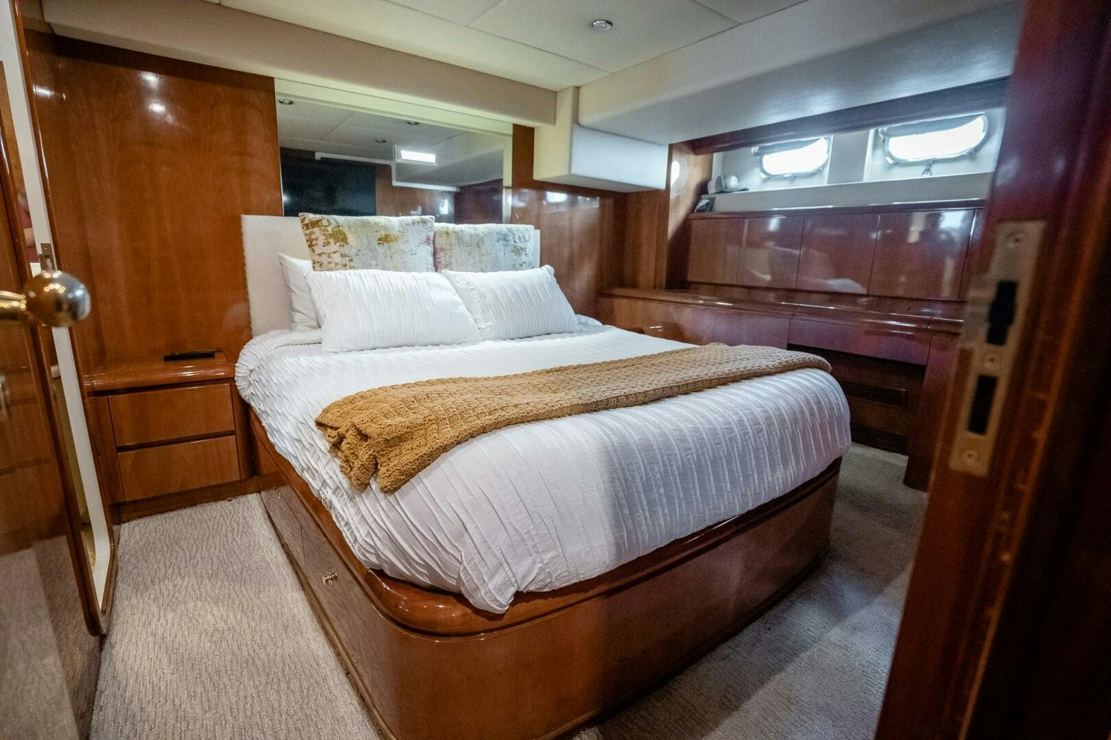 a bed in a room aboard PURA VIDA  Yacht for Sale