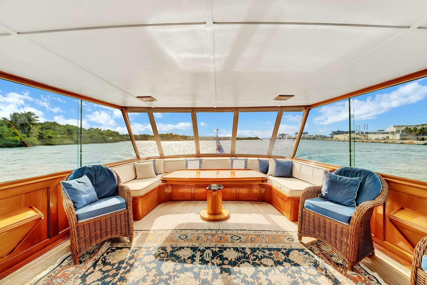 a room with a couch and a table and a rug aboard EAGLE Yacht for Sale