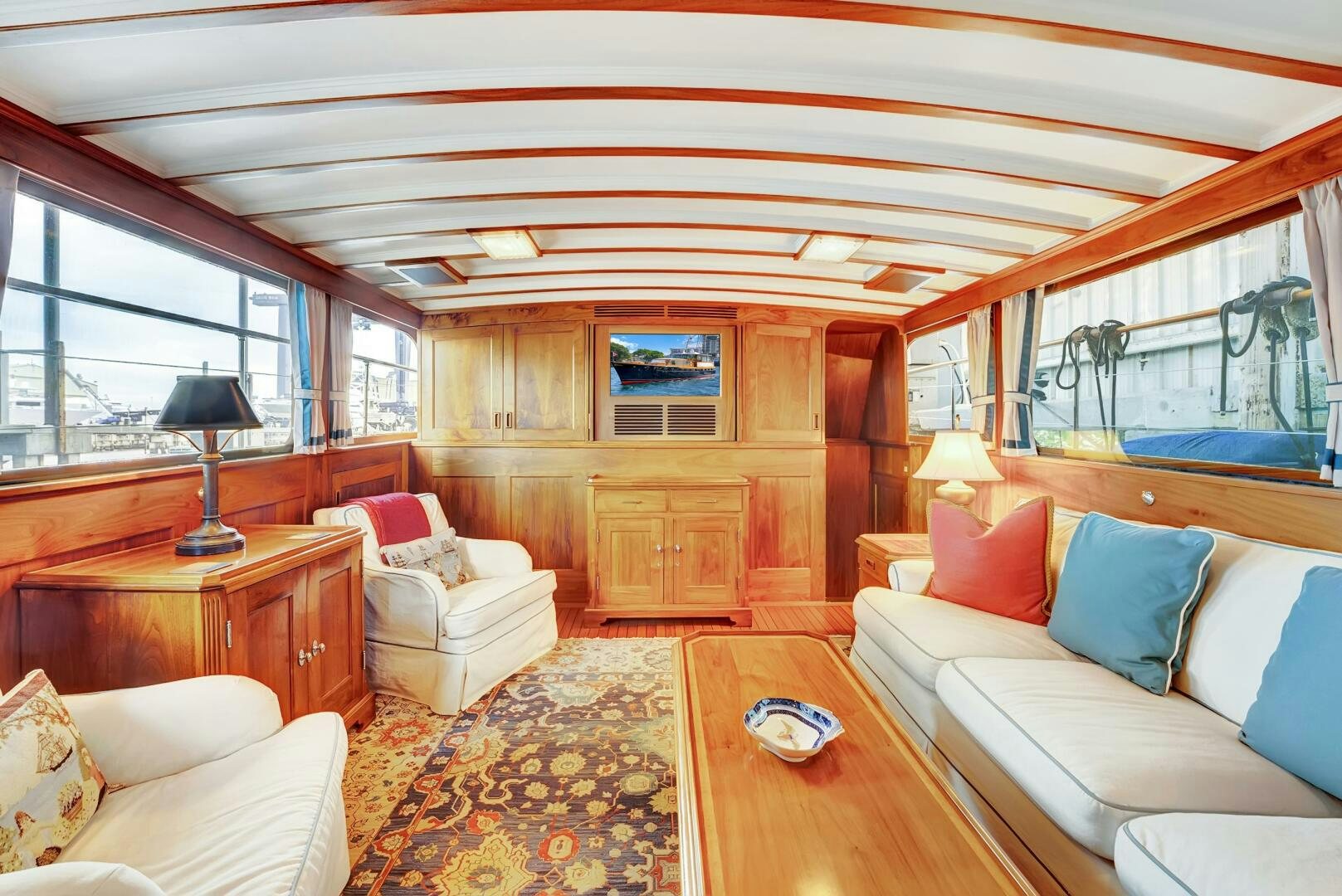 a living room with a large window aboard EAGLE Yacht for Sale