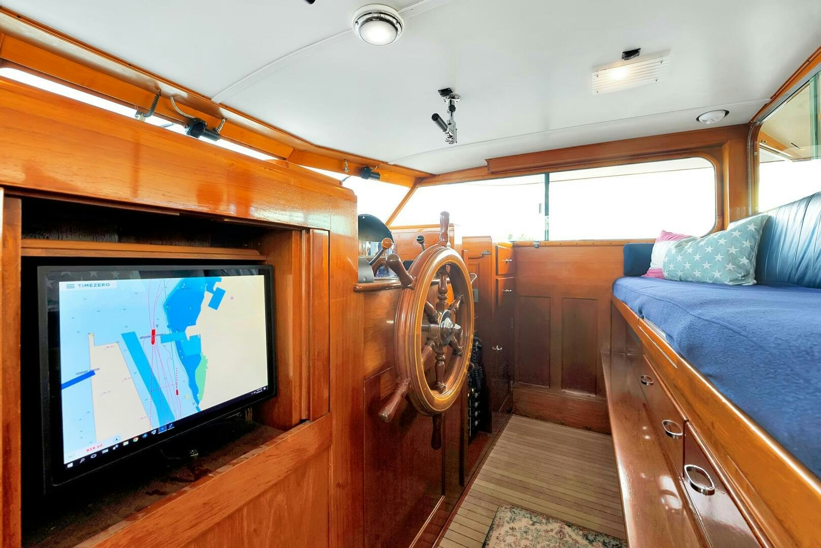 a cabin with a television and a bed aboard EAGLE Yacht for Sale