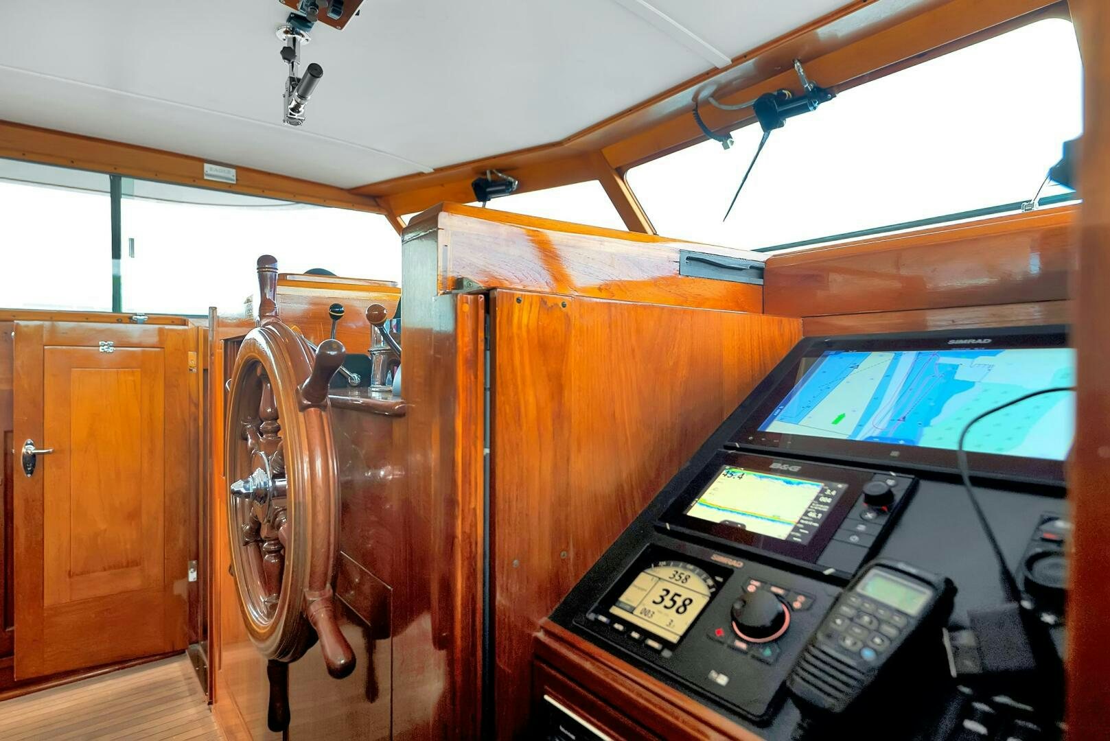 a wooden cabinet with a few knobs and knobs aboard EAGLE Yacht for Sale