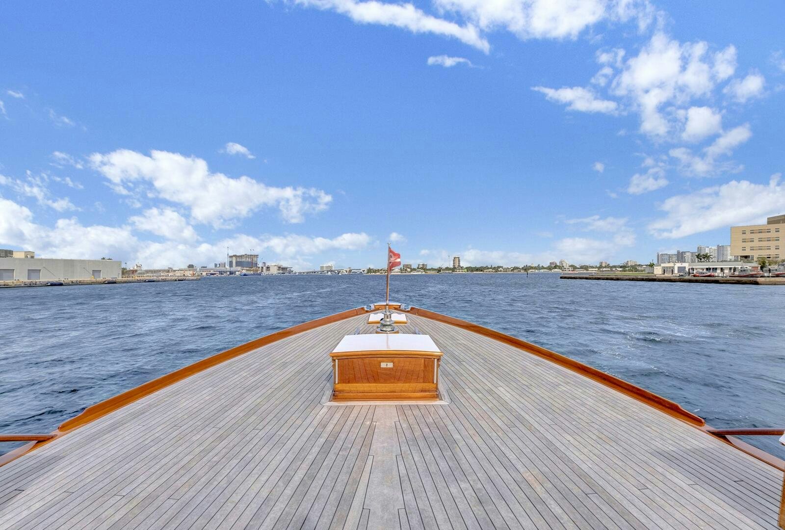 a wooden dock with a flag on it aboard EAGLE Yacht for Sale