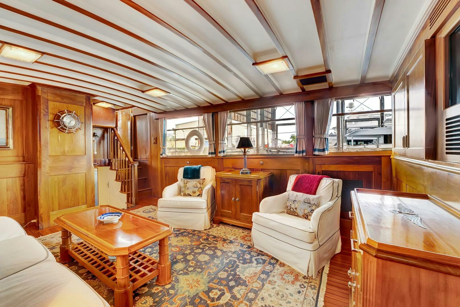 a living room with a large window aboard EAGLE Yacht for Sale