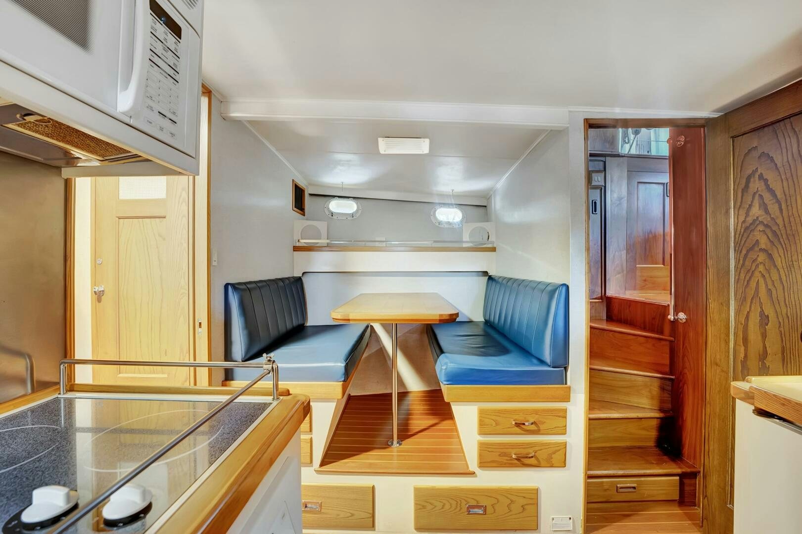 a room with a table and chairs aboard EAGLE Yacht for Sale