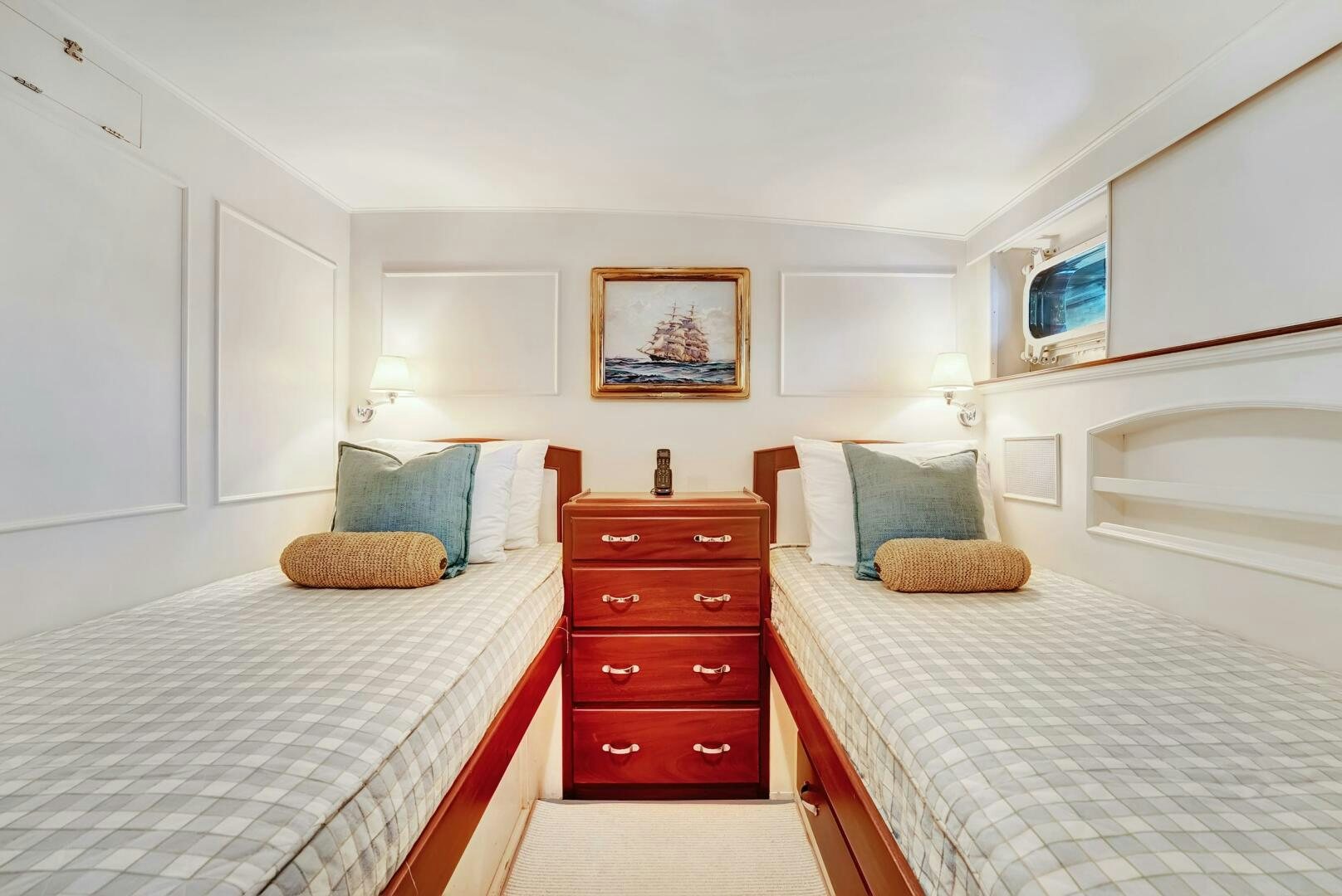 a bedroom with a bed and a dresser aboard EAGLE Yacht for Sale