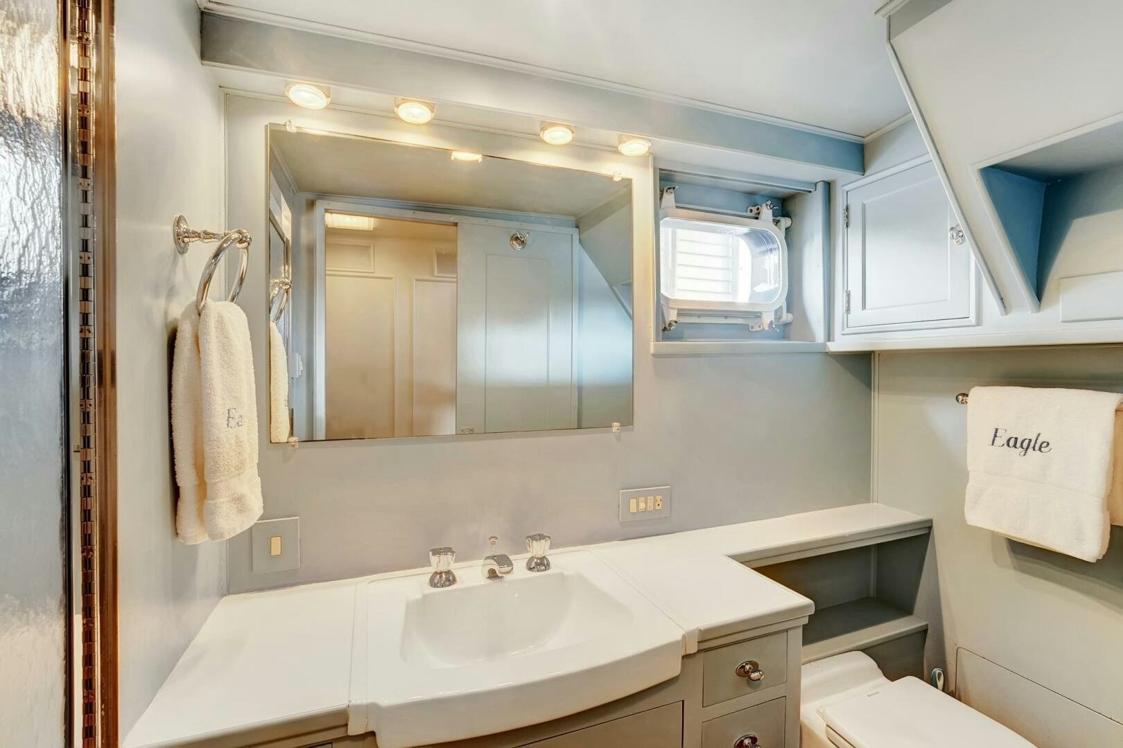 a bathroom with a large mirror aboard EAGLE Yacht for Sale