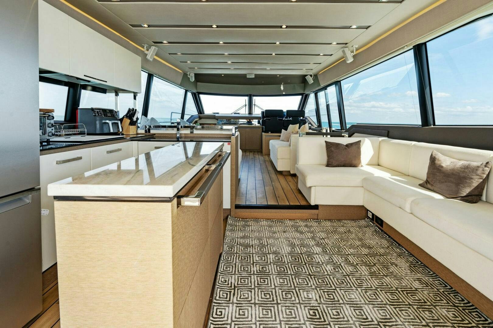 a large kitchen with a large window aboard PRESTIGE WORLDWIDE Yacht for Sale