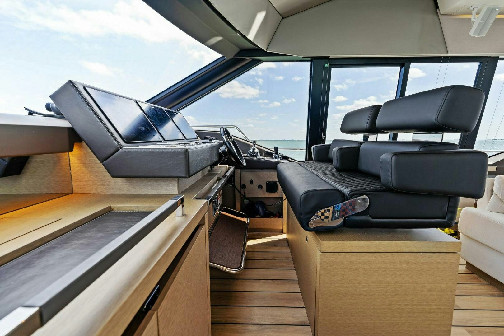 inside of a car aboard PRESTIGE WORLDWIDE Yacht for Sale