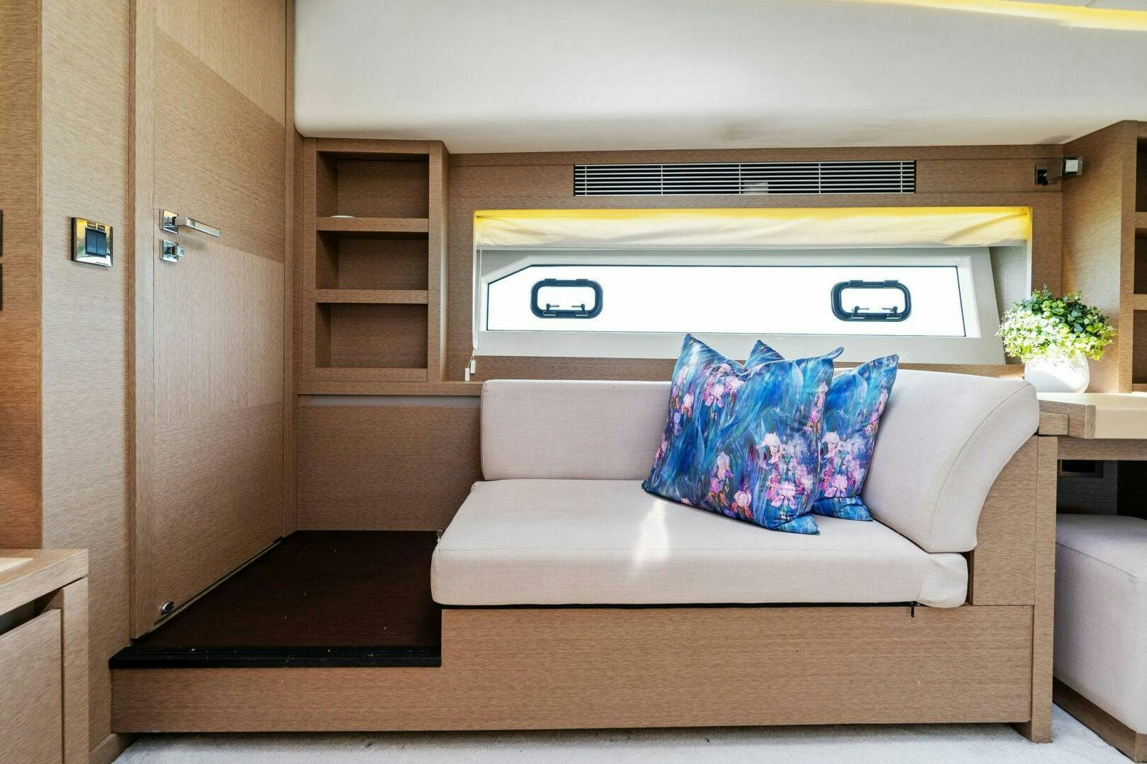 a couch in a room aboard PRESTIGE WORLDWIDE Yacht for Sale