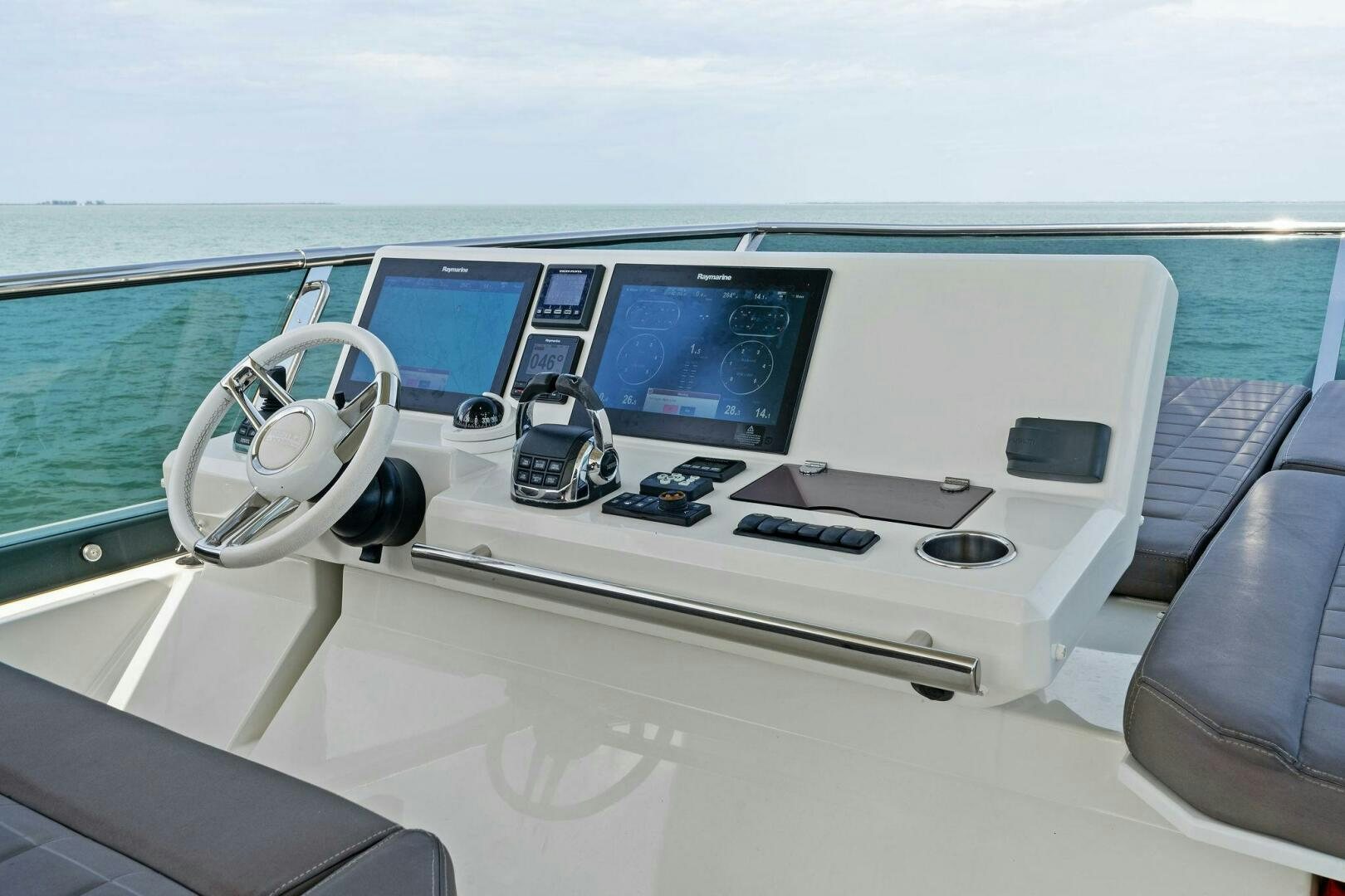 a boat with multiple monitors aboard PRESTIGE WORLDWIDE Yacht for Sale