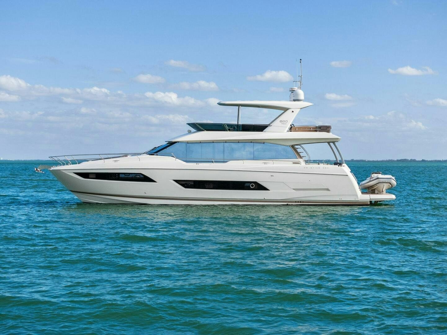 a white yacht in the water aboard PRESTIGE WORLDWIDE Yacht for Sale