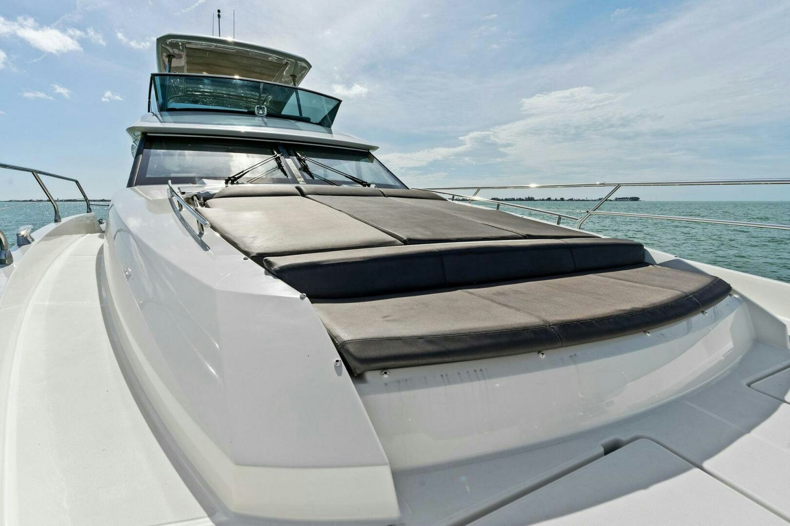 a boat on the water aboard PRESTIGE WORLDWIDE Yacht for Sale