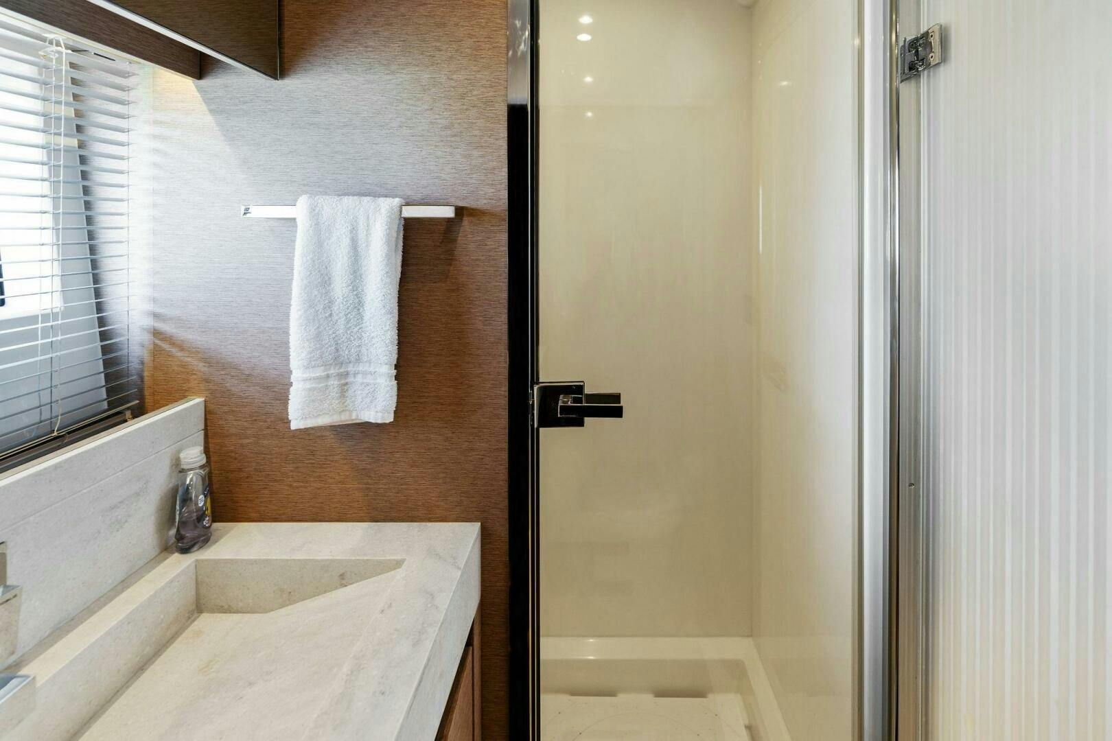 a bathroom with a sink and a bathtub aboard PRESTIGE WORLDWIDE Yacht for Sale