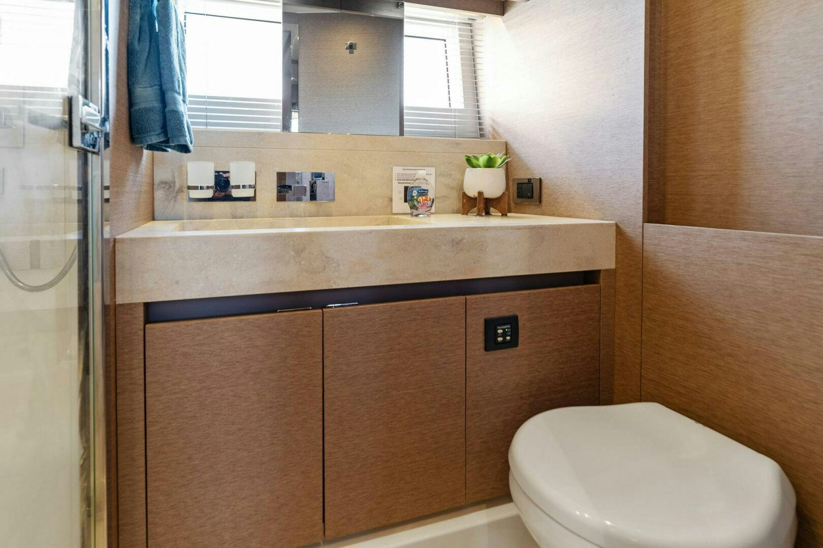 a bathroom with a sink and a toilet aboard PRESTIGE WORLDWIDE Yacht for Sale