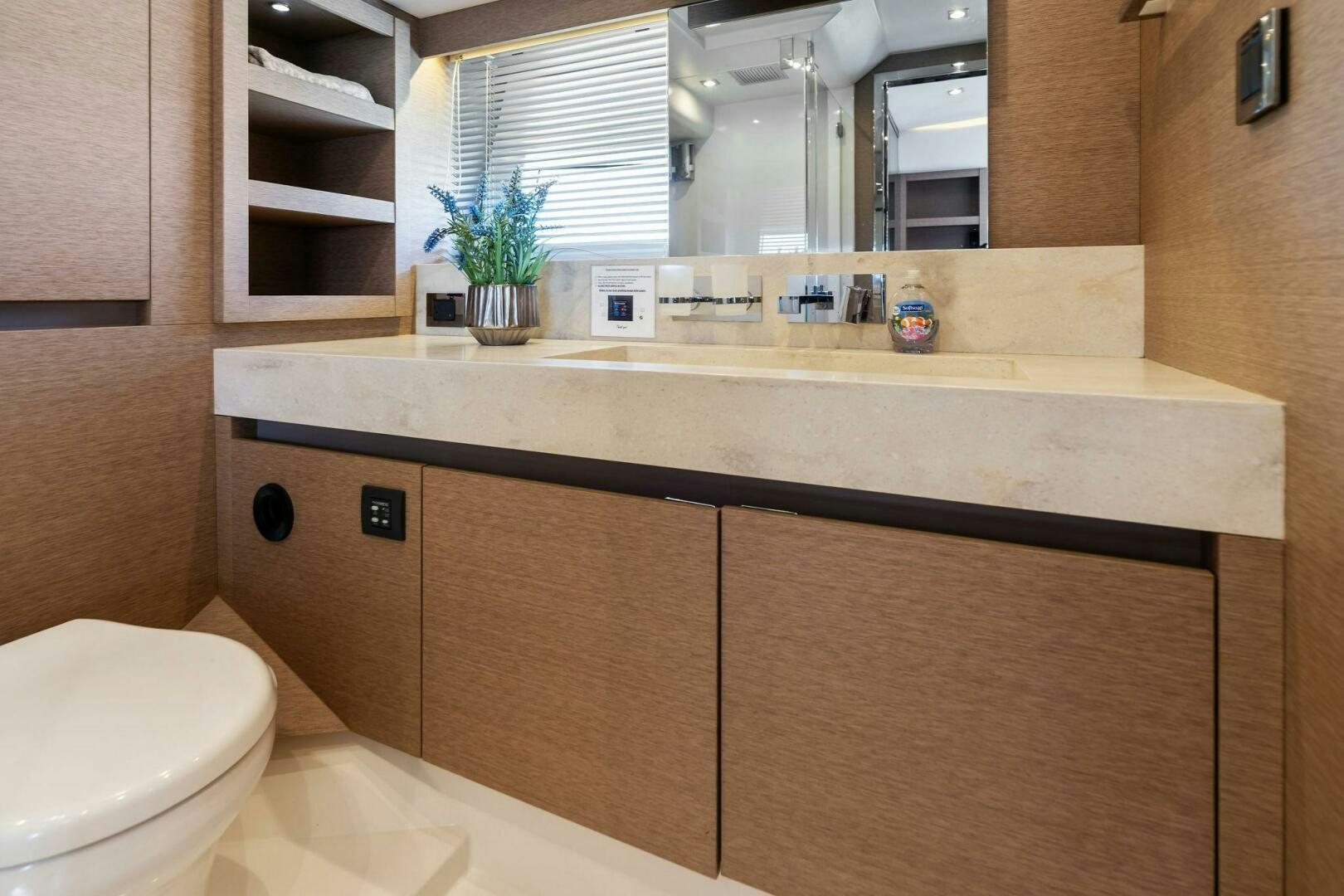 a bathroom with a sink and cabinets aboard PRESTIGE WORLDWIDE Yacht for Sale