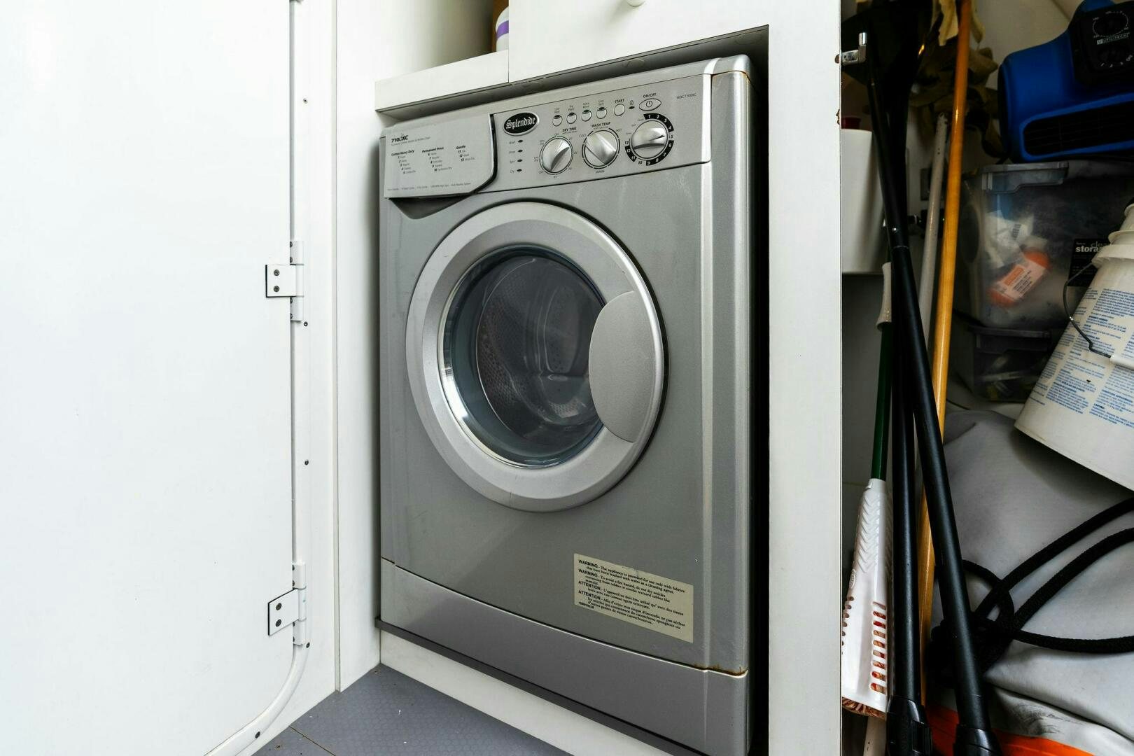 a white washing machine aboard PRESTIGE WORLDWIDE Yacht for Sale