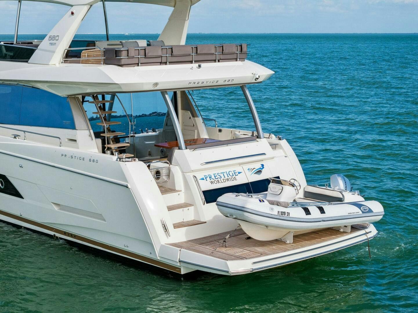 a white boat on the water aboard PRESTIGE WORLDWIDE Yacht for Sale