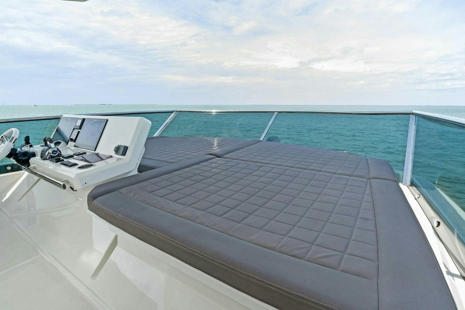 a deck with a laptop on it aboard PRESTIGE WORLDWIDE Yacht for Sale