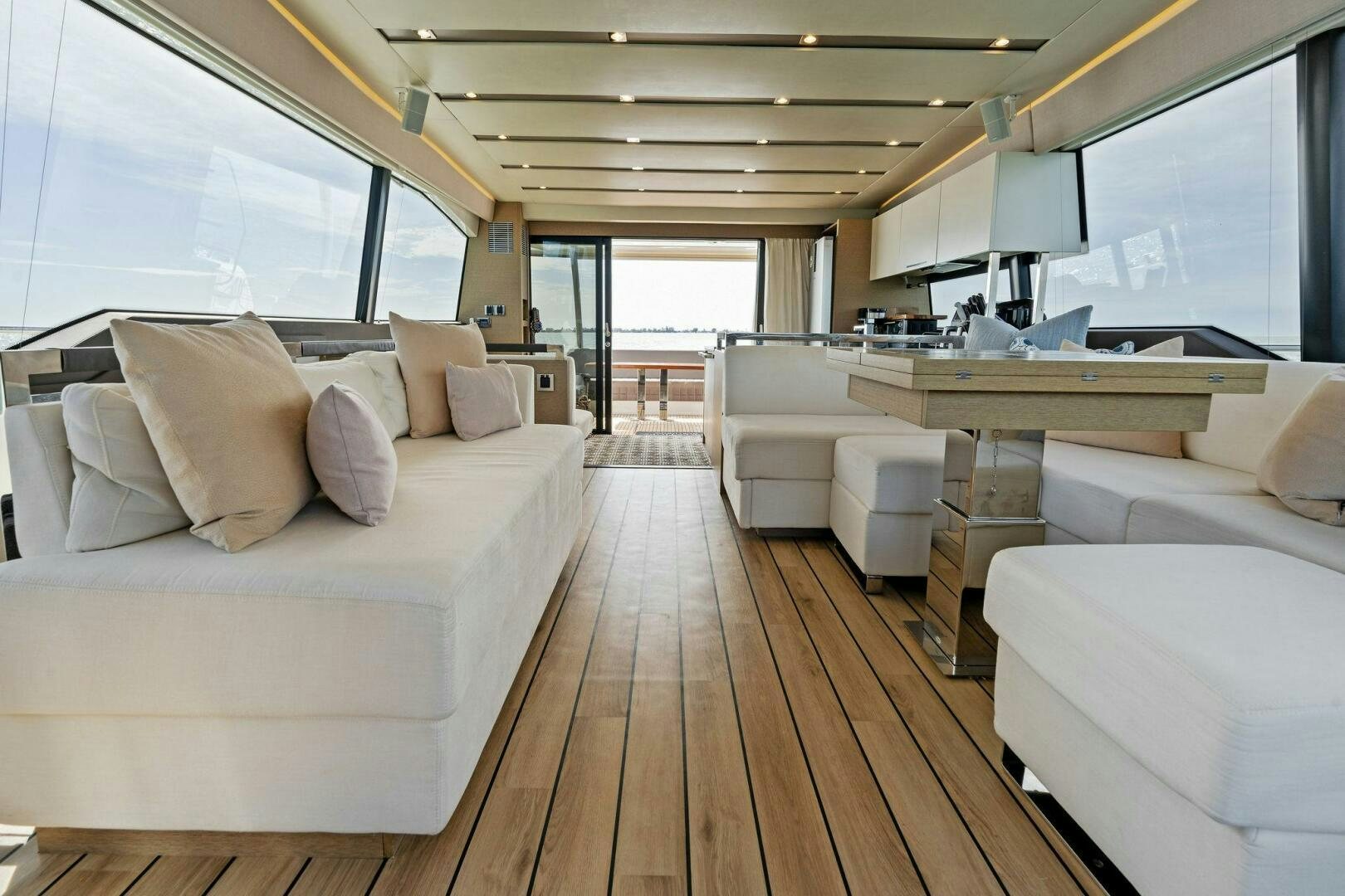 a room with a large bed and a large window aboard PRESTIGE WORLDWIDE Yacht for Sale