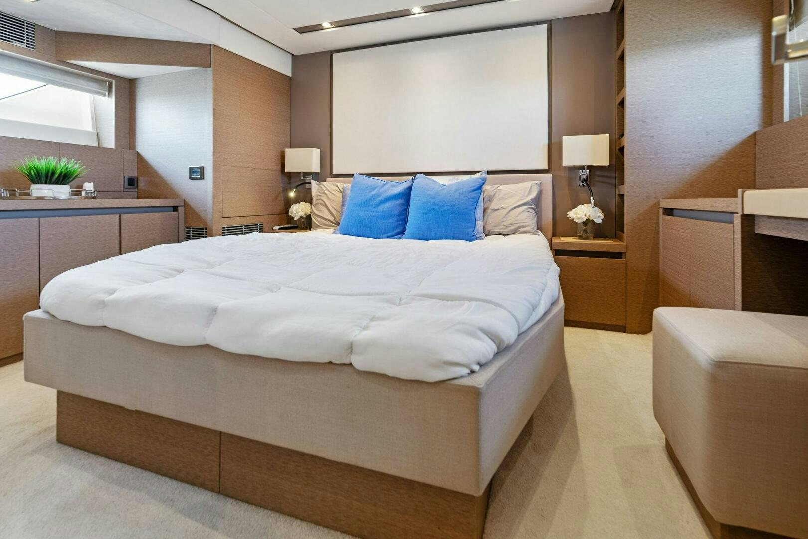 a large bed in a hotel room aboard PRESTIGE WORLDWIDE Yacht for Sale